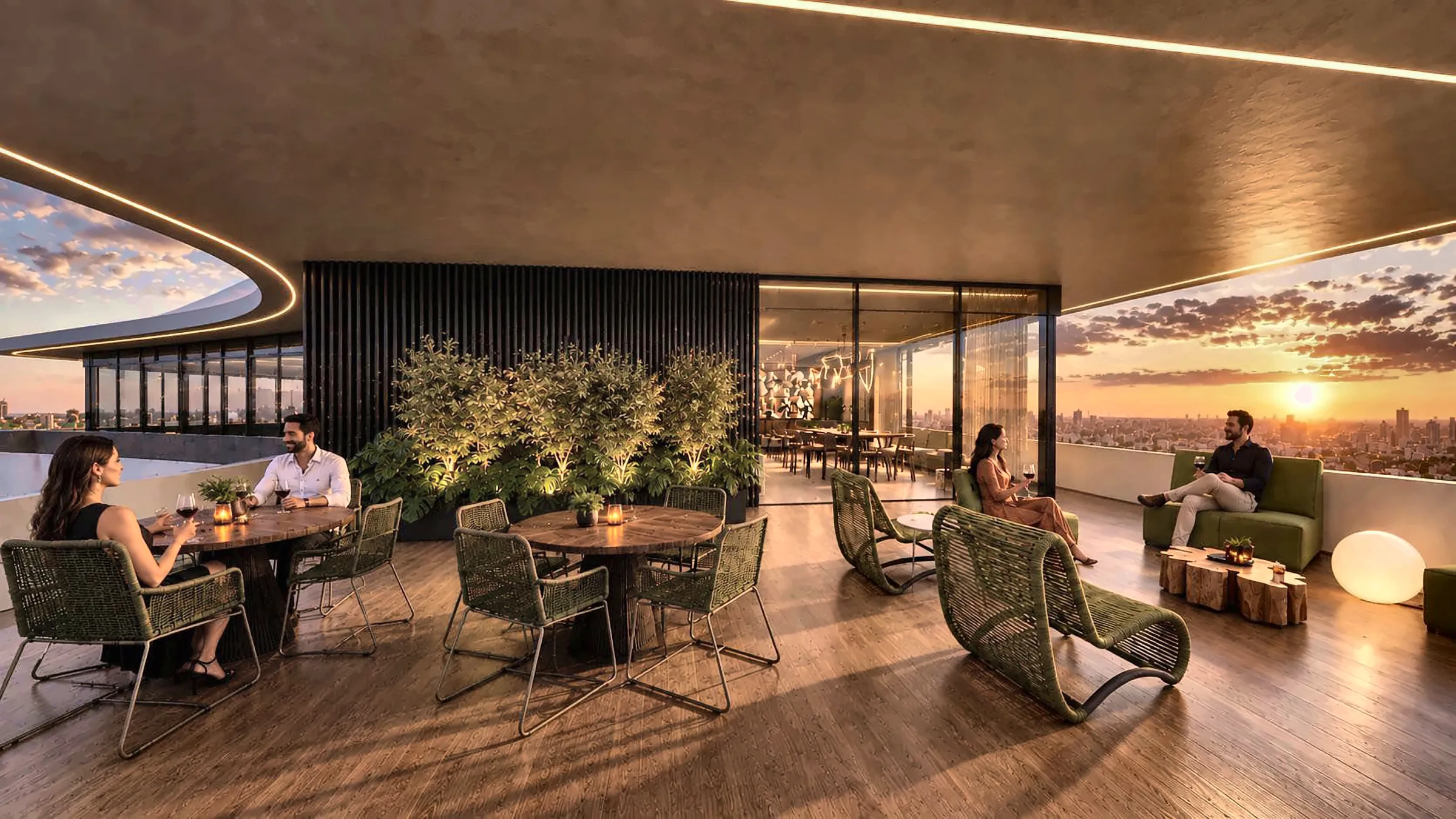 Lounge externo com mesas e poltronas ao pôr do sol